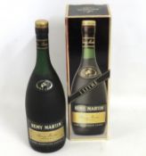 A boxed one litre bottle of fine champagne Remy Ma