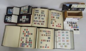 Four world stamp albums & two others twined with a