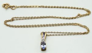A 9ct gold chain with diamond & tanzanite pendant,