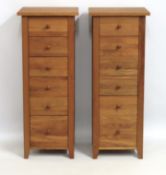 A tall pair of oak chests comprising six drawers e
