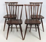 A set of four c.1960s elm seated Ercol 391 dining