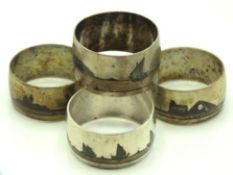 Four white metal niello napkin rings, each signed,