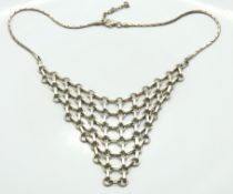 A silver chain mail bib necklace, 380mm long, 27.5