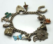A silver charm bracelet with enamelled moth, typew