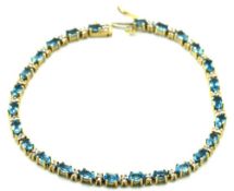 A 9ct gold topaz bracelet with approx. 0.52ct of d