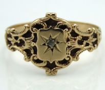 An antique yellow metal ring set with small diamon