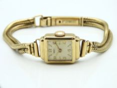 A 9ct gold ladies Tissot wristwatch, winds & runs,