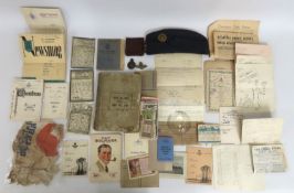A WW2 RAF cap, an air force cap badge, a 1914 Buck