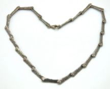 A retro modernist avantgarde silver bar link neckl