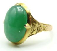 A 14ct gold jade set ring with Oriental marks, sto
