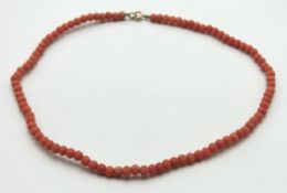 A c.1900 set of coral beads with 9ct gold clasp, 3