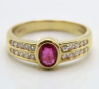 An 18ct gold ring set with ruby & approx. 0.2ct of