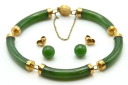A vintage Oriental jade bracelet set in 14ct gold, 200mm long, twinned with a pair of yellow metal m