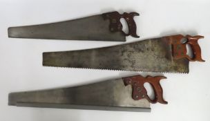 Three Henry Disston hand saws, largest 780mm