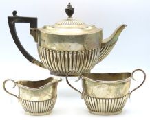 A three piece matched silver tea service, teapot L