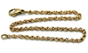 A yellow metal bracelet with links, 247mm long, ch