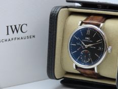A boxed IWC Portofino hand wound eight days men's