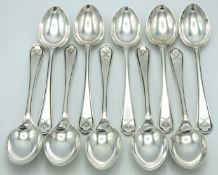 A set of ten 1933 Chester silver teaspoons with hockey sticks & ball on handles by Walker & Hall, 11