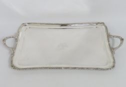 A 1909 Edwardian Edinburgh silver tray by Hamilton & Inches, monogrammed 'AJ', loss of foot, 620mm x