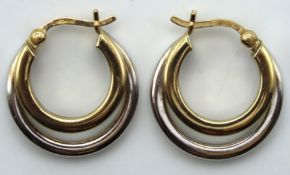 A pair of 9ct two colour gold double hoop earrings