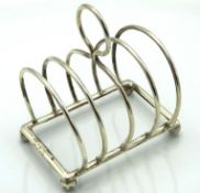 A 1920 Birmingham silver wire toast rack by William Hutton & Sons, 84mm high x 57mm wide, 52.3g