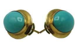 A pair of yellow metal earrings set with turquoise