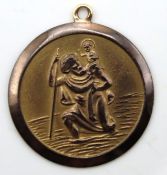 A 9ct gold St. Christopher, some tarnishing to gol