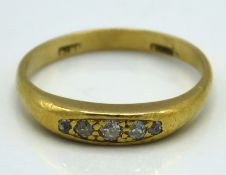 An antique 18ct gold five stone diamond ring of ap