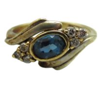 A 9ct gold ring set with diamond & topaz, 3.5g, si