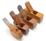 Four wooden luthier planes