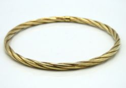 A 9ct gold rope bangle, internal diameter 62.5mm,