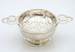 A 1944/45 Birmingham silver tea strainer & stand b