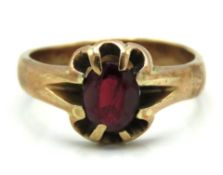 A 9ct gold ring set with garnet, 5.8g, size U/V