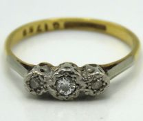 An antique 18ct gold ring set with three diamonds