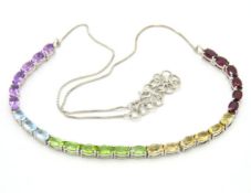 A decorative silver necklace set with amethyst, to