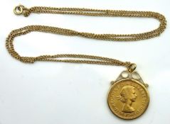 A 9ct gold mounted 1964 QEII full gold sovereign w