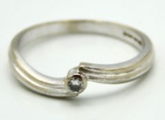 A contemporary styled 18ct gold diamond solitaire