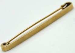 A 15ct gold bar brooch, 50mm wide, 2.6g