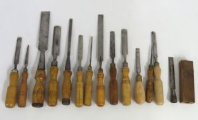 A collection of vintage wooden handled chisels inc