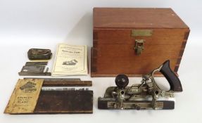 A cased Stanley no. 45 combination plane with cutt