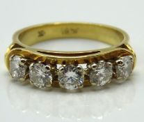 A c.1960s 18ct gold half eternity ring set with ap
