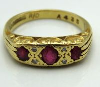 An 18ct gold ring set with ruby & small diamonds,