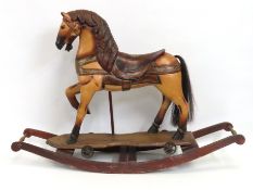 A mid 20thC. rocking horse, 1215mm wide x 830mm hi