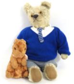 An early 20thC. Chiltern style teddy bear twinned