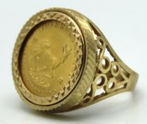 A 9ct gold set ring set with a 1982 10th of ounce