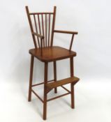 An antique Windsor style child's high chair, repai