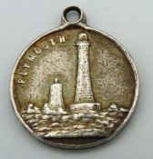 An Edwardian silver pendant featuring Eddystone li