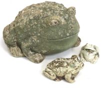 A large garden stoneware toad & two smaller ones,