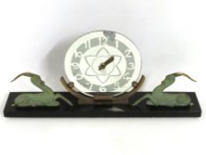 A French art deco clock on marble base with gazell
