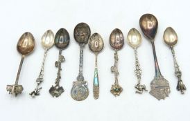 A selection of nine silver & white metal tourist/c